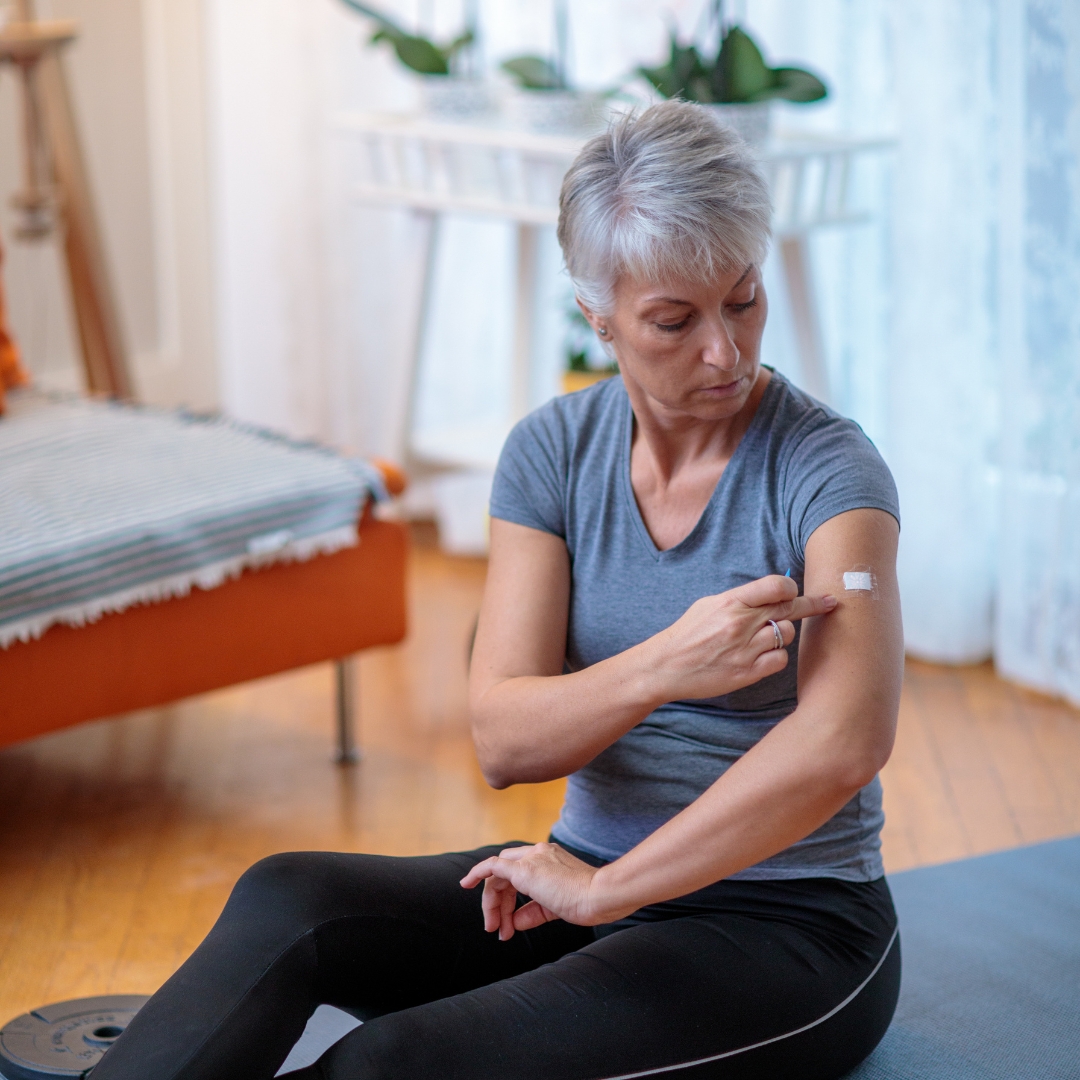 Kloris menopause patch applied by woman to arm