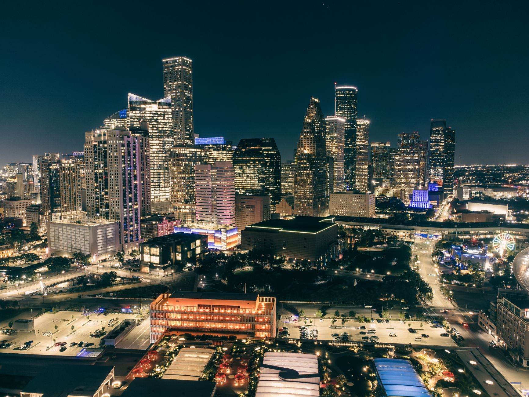night cityscape with illuminated skyscrapers