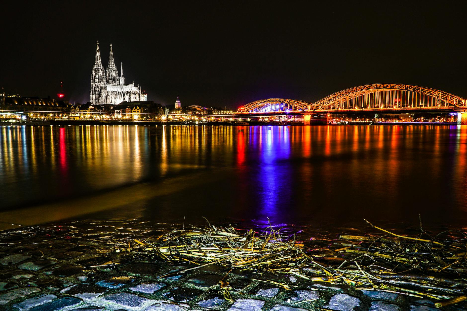 bridge near cathedral during night time