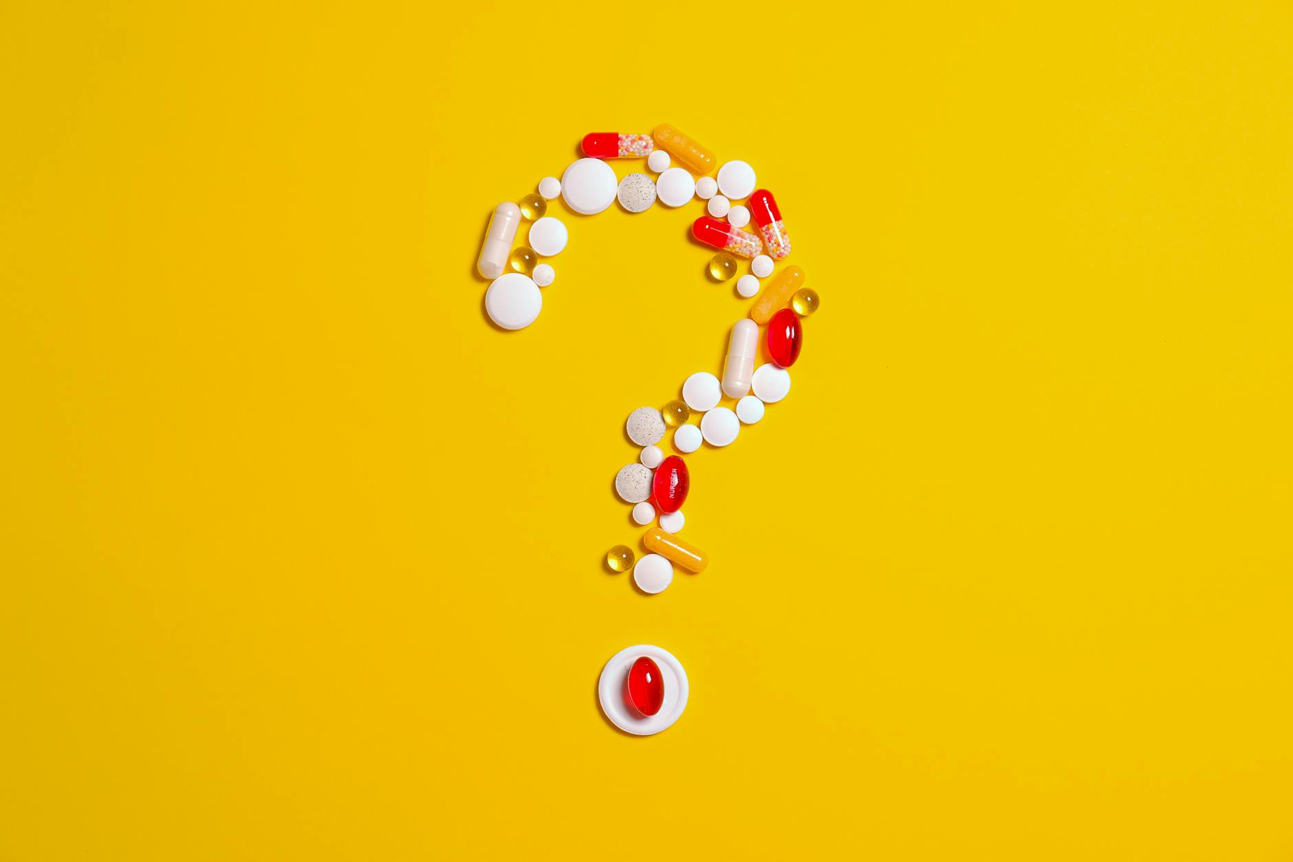 medication pills isolated on yellow background