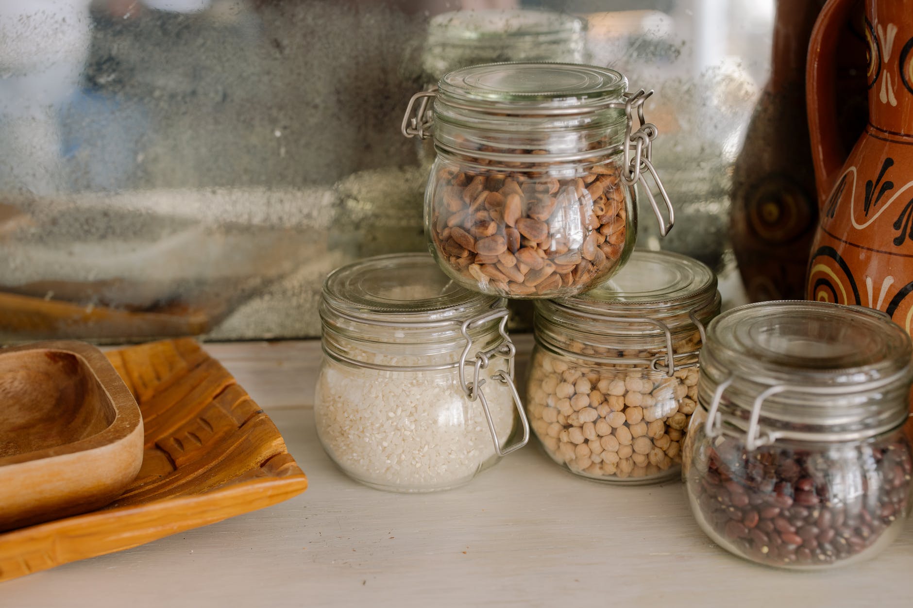 clear glass jars on white wooden table