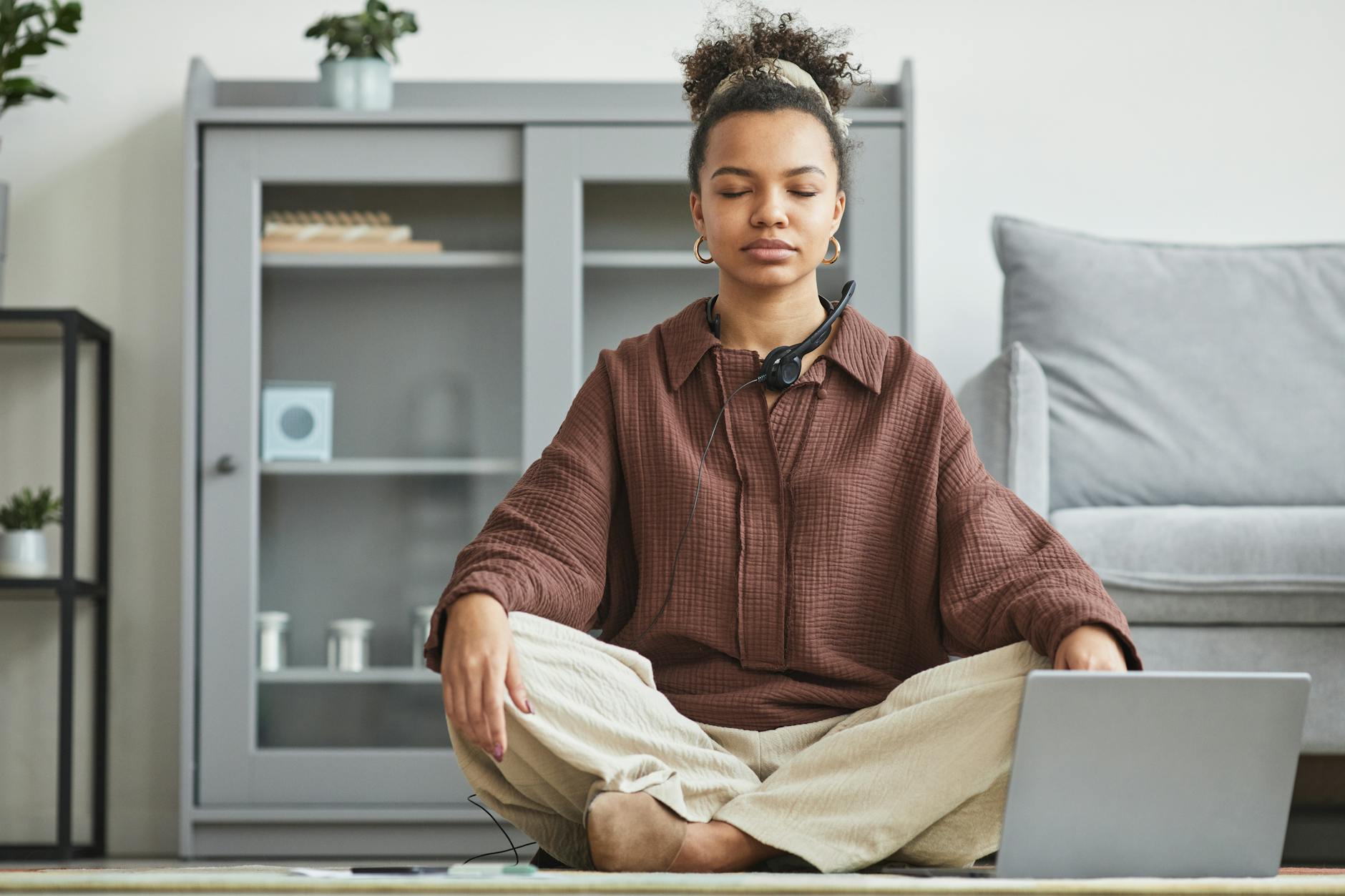 woman in brown top meditating