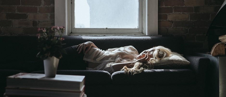 Woman strugging to sleep after drinking alcohol.